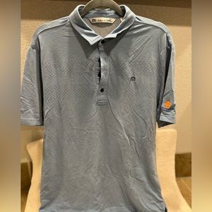 Blue Travis Mathew golf polo shirt